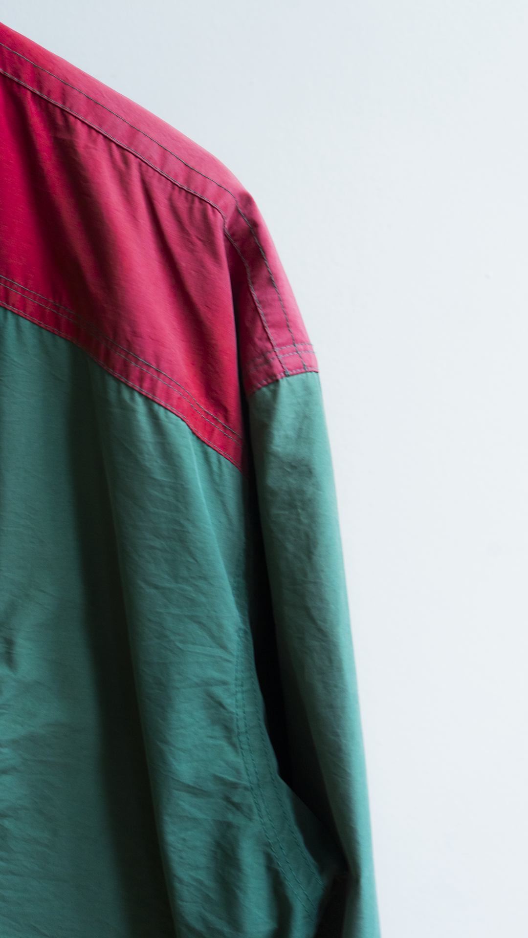 detail of 80s raincoat green and red