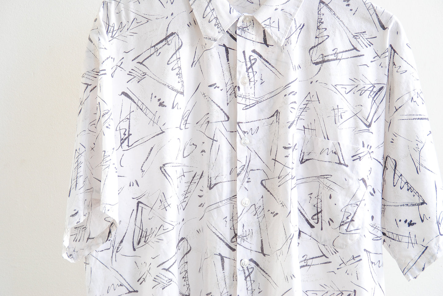 White vintage shirt with black abstract pattern and buttons detail