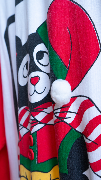 detail of a 80s christmas nightshirt with teddy bear wearing a santa hat with a 3D pom-pom.