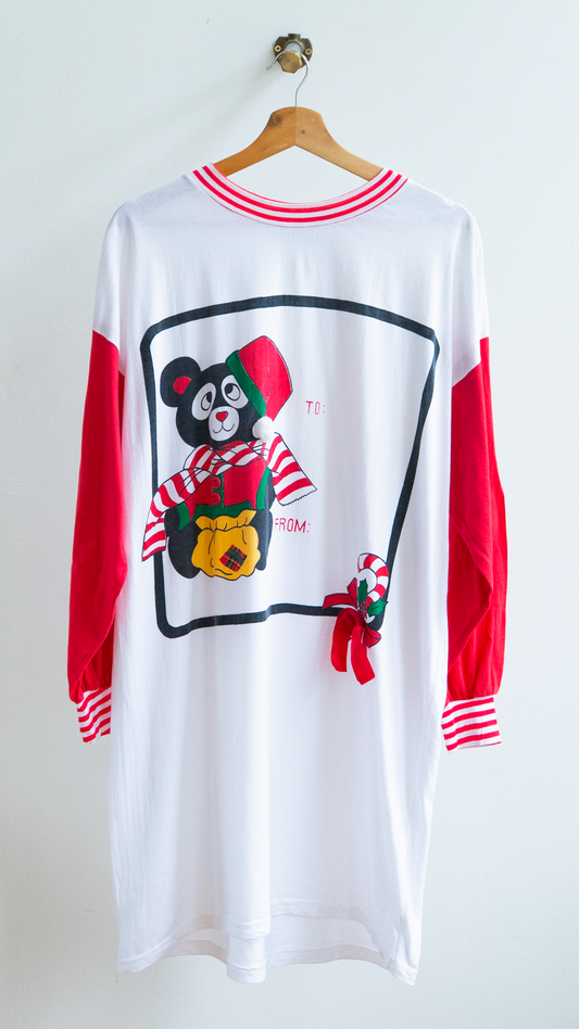 80s christmas oversized onesize nightshirt in white with red sleeves featuring a teddy bear in winter outfit and a candy cane.