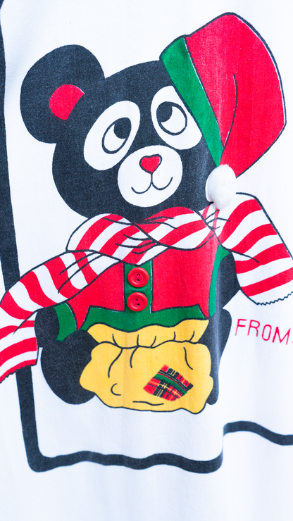 detail of teddy bear in festive outfit on a onesize christmas nightshirt with 3D details with distinct 80s character
