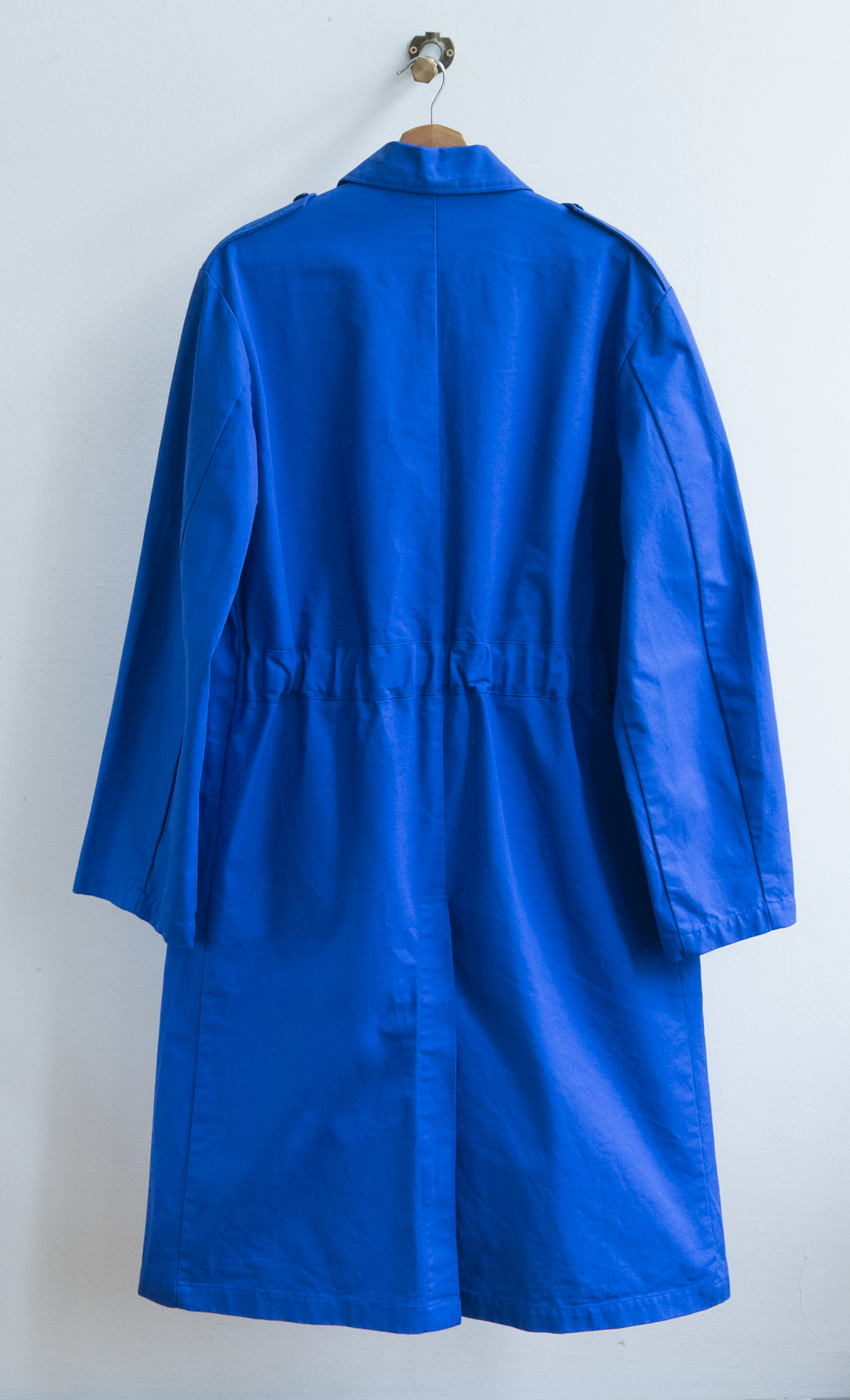 long blue vintage worker coat from the back