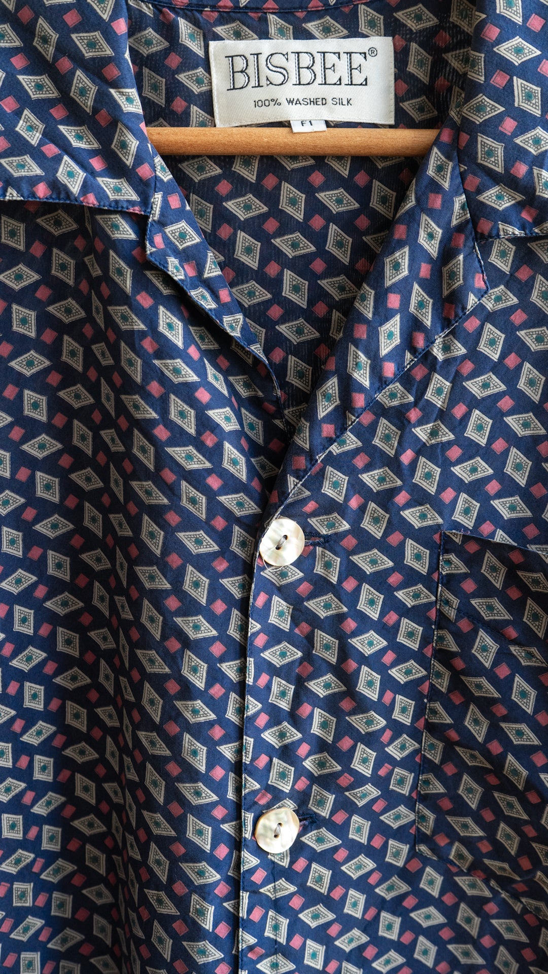 detail of rosemary vintage shirt blue silk vintage shirt with pink and white and mother of pearl buttons fresh vintage