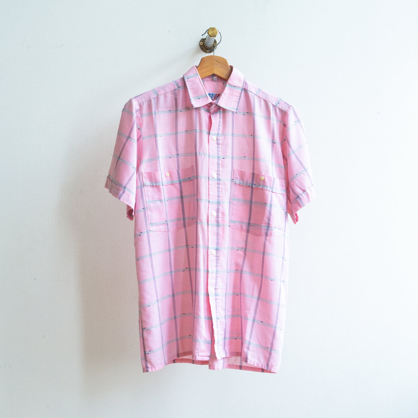soft pink checkered vintage shirt with white and black lines on hanger