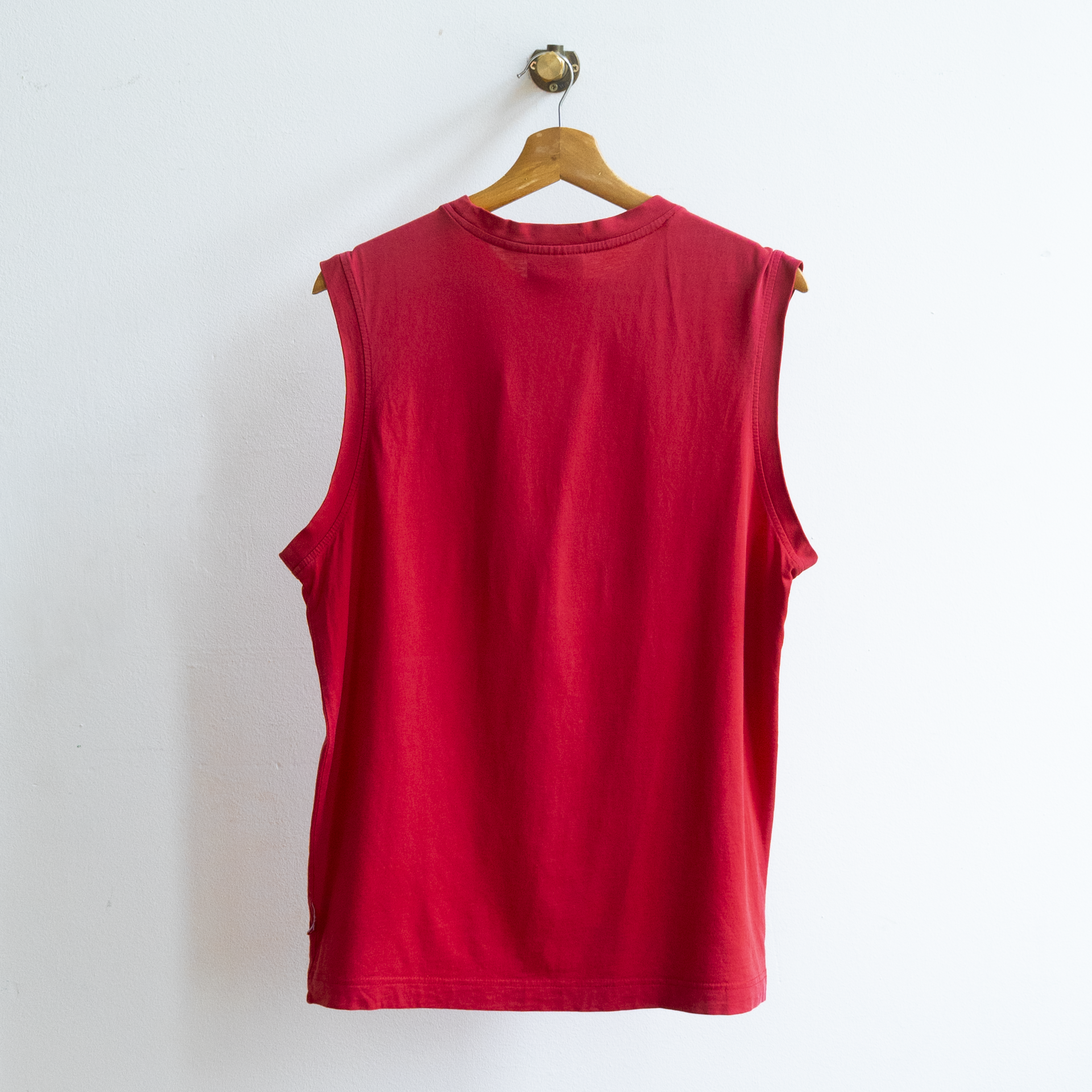 red secondhand sleeveless Puma top with low side cut-outs
