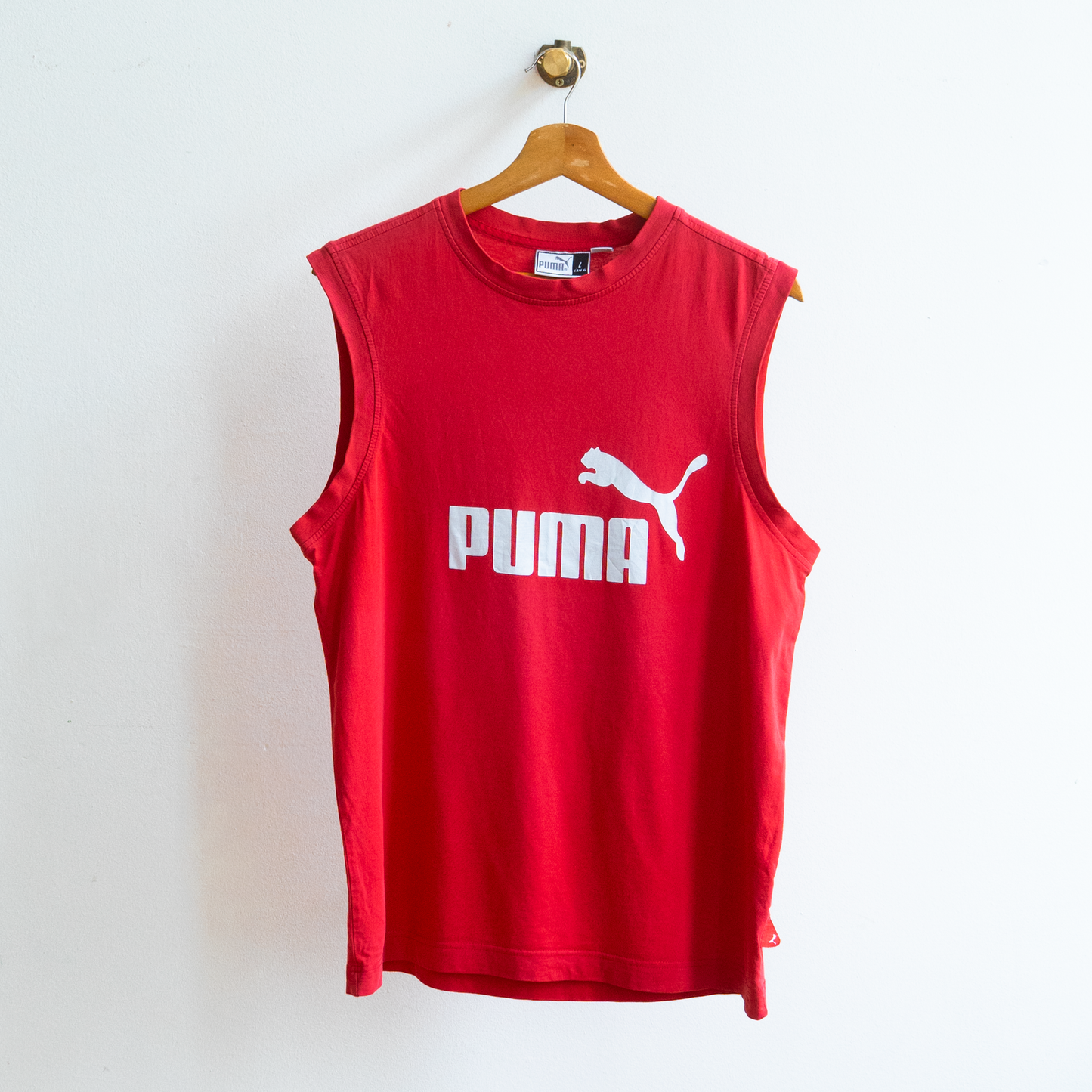 red secondhand sleeveless Puma top with dropped armholes