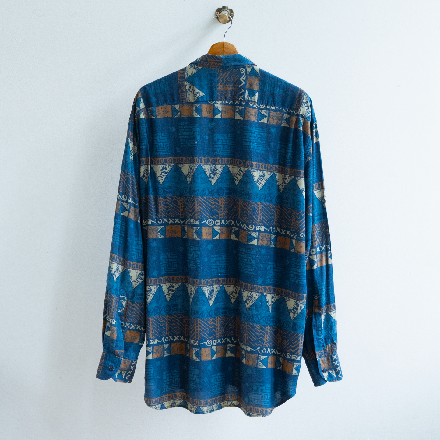 back of secondhand dark blue patterned shirt